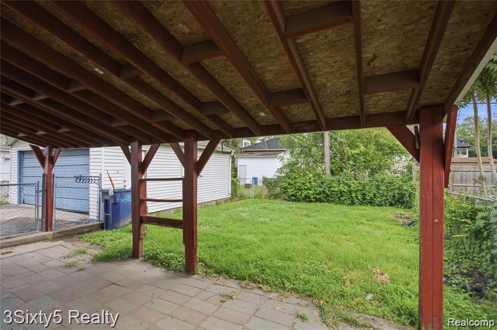 147 Charles Street River Rouge, MI 48218 - Photo 17 of 24 Covered outdoor space featuring a paved patio and a grass area