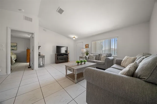 a living room with furniture and a view of living room