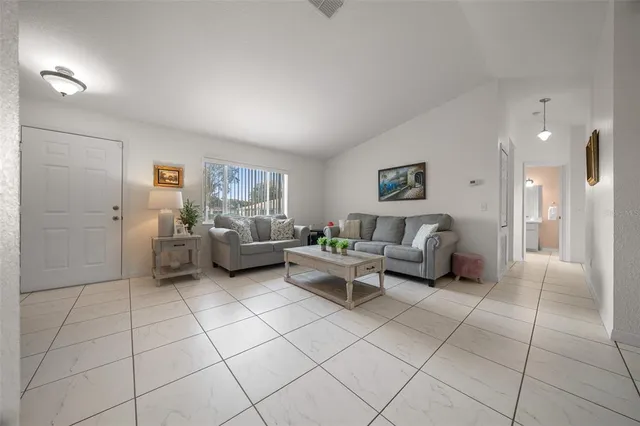 a living room with furniture and a couch