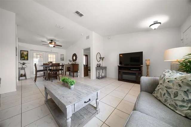 a view of a livingroom with furniture and a stove