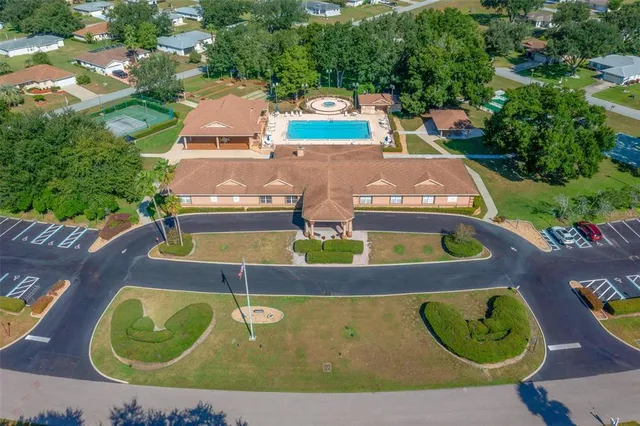 a view of a chairs and table in the balcony