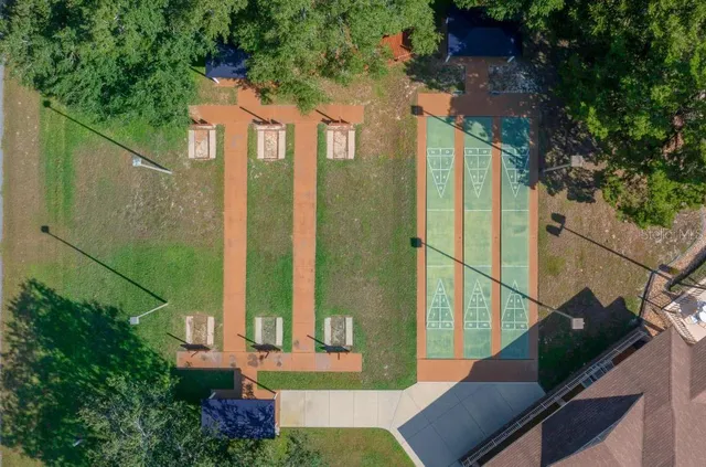a view of a playground with basketball court