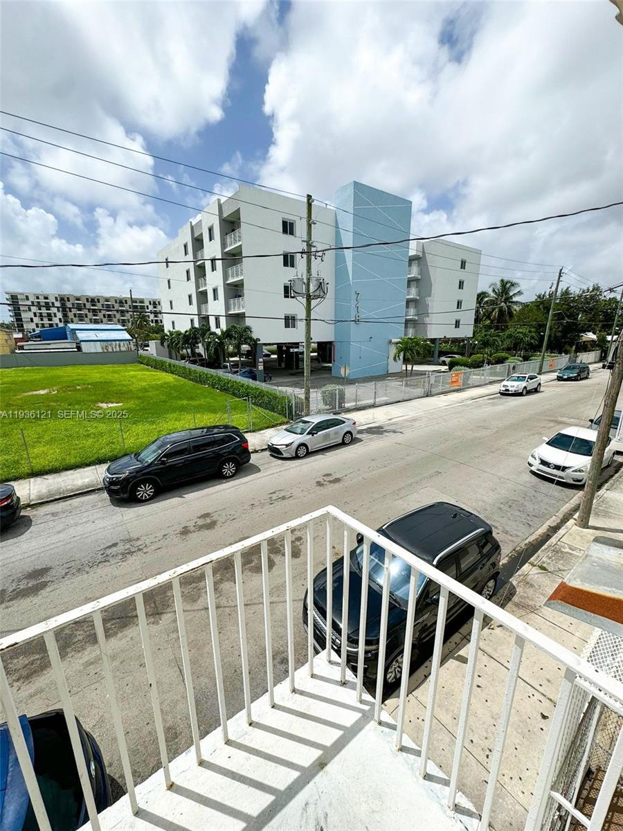 711 Northwest 1st Street, Unit 3 Miami, FL 33128 - Photo 3 of 14 a view of a balcony with yard