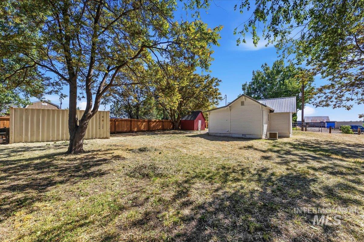 109 Parma Road Parma, ID 83660 - Photo 28 of 31 Expansive rear yard featuring a mature tree, wood fencing