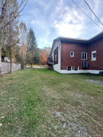 a view of a house with a big yard