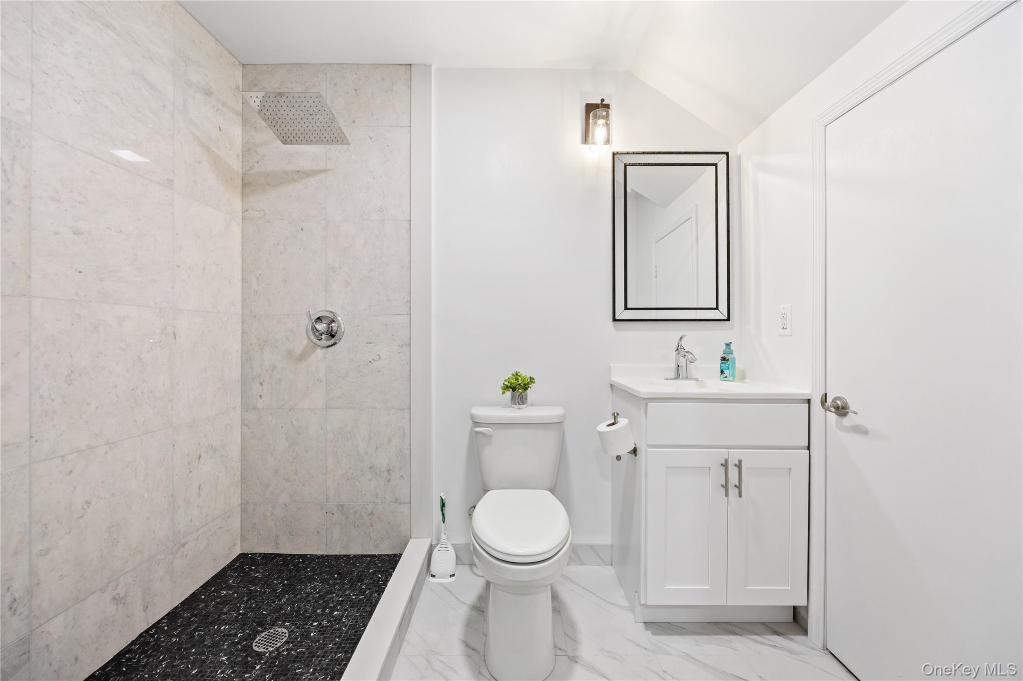 23 Cooley Road Parksville, NY 12768 - Photo 31 of 43 a bathroom with a toilet a sink and mirror