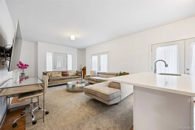 a bedroom with a large bed and a couch