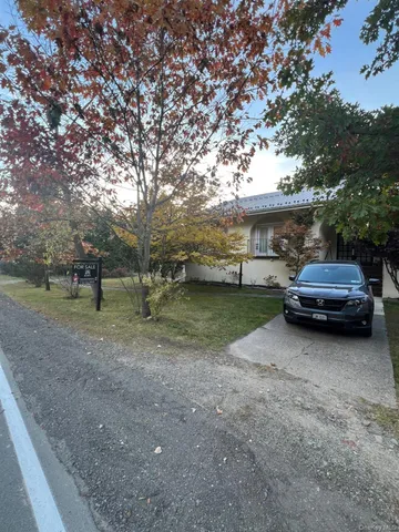 a view of street with parked cars