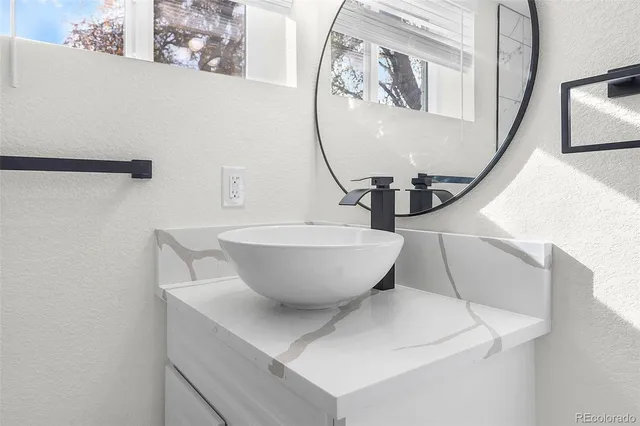 a view of a hallway with wooden floor and entryway