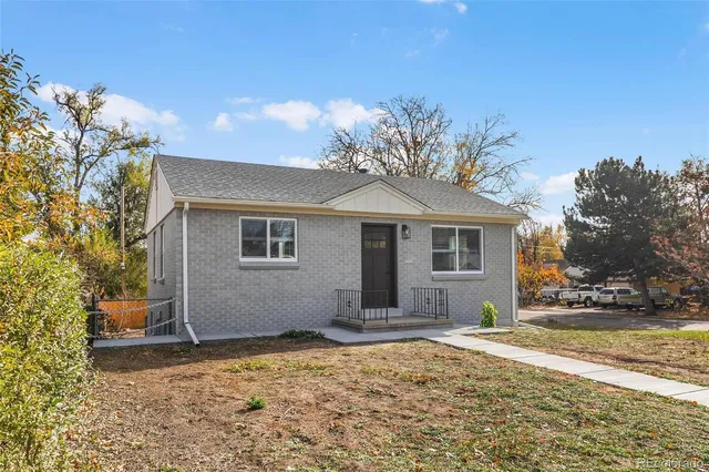 a house with trees in the background