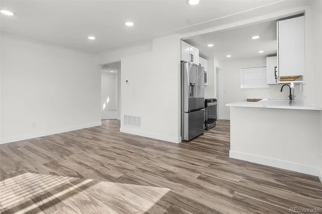 a view of a kitchen from the hallway