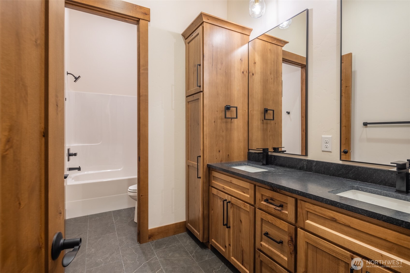 110 Bitterroot Lane Ronald, WA 98940 - Photo 14 of 28 a bathroom with a granite countertop sink a mirror and a bathtub
