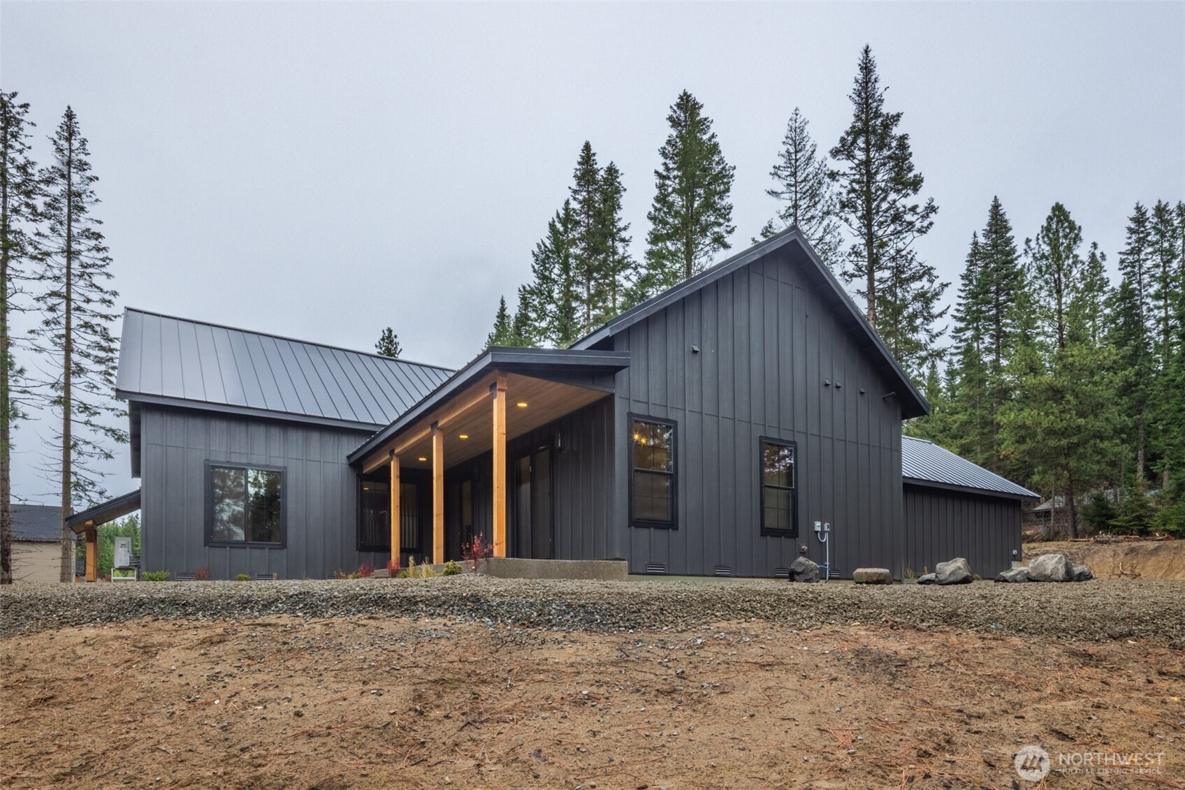 110 Bitterroot Lane Ronald, WA 98940 - Photo 24 of 28 a front view of a house with a yard and garage