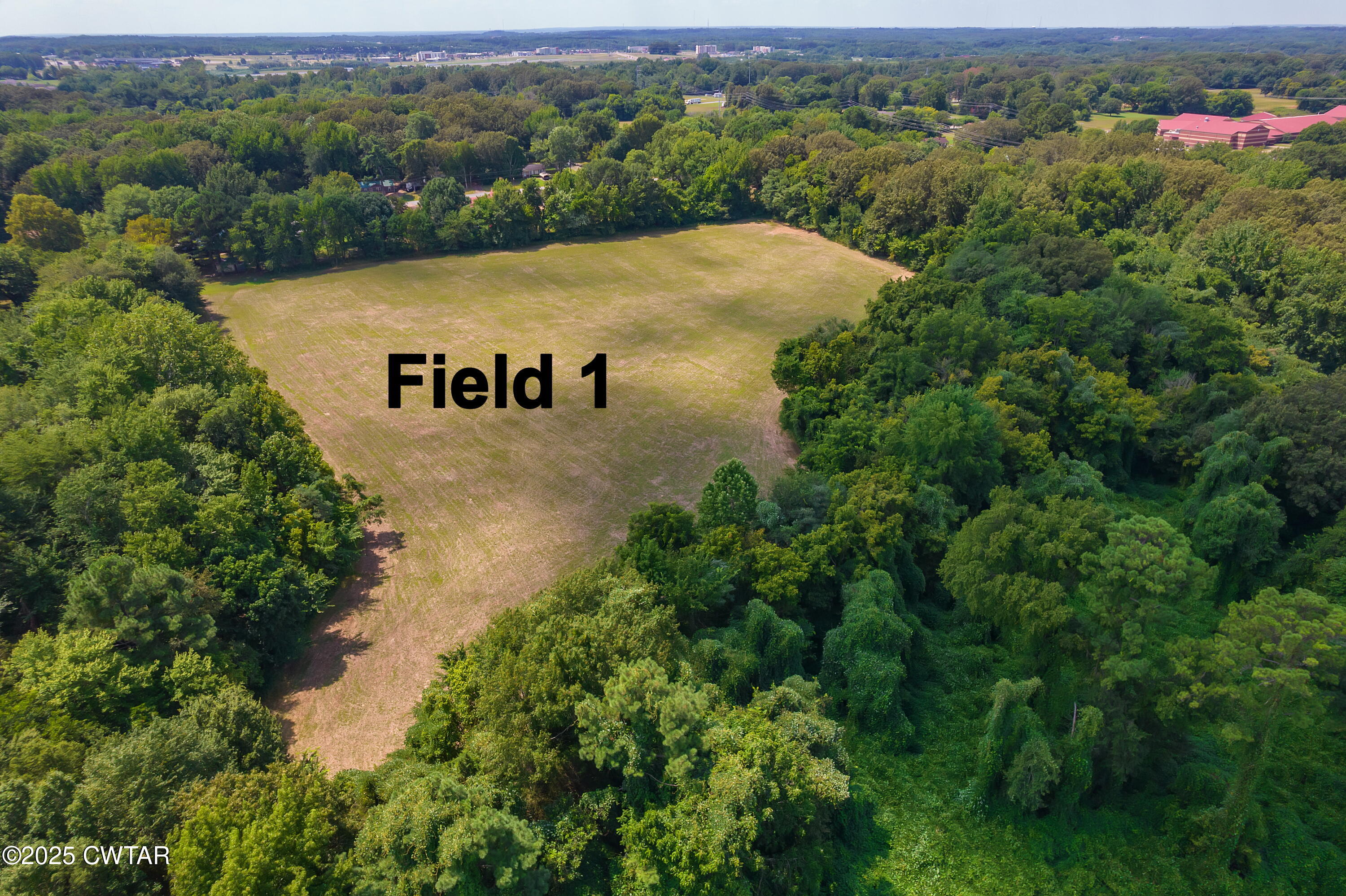0 Rider Drive Jackson, TN 38305 - Photo 7 of 7 an aerial view of a house with a yard and lake view