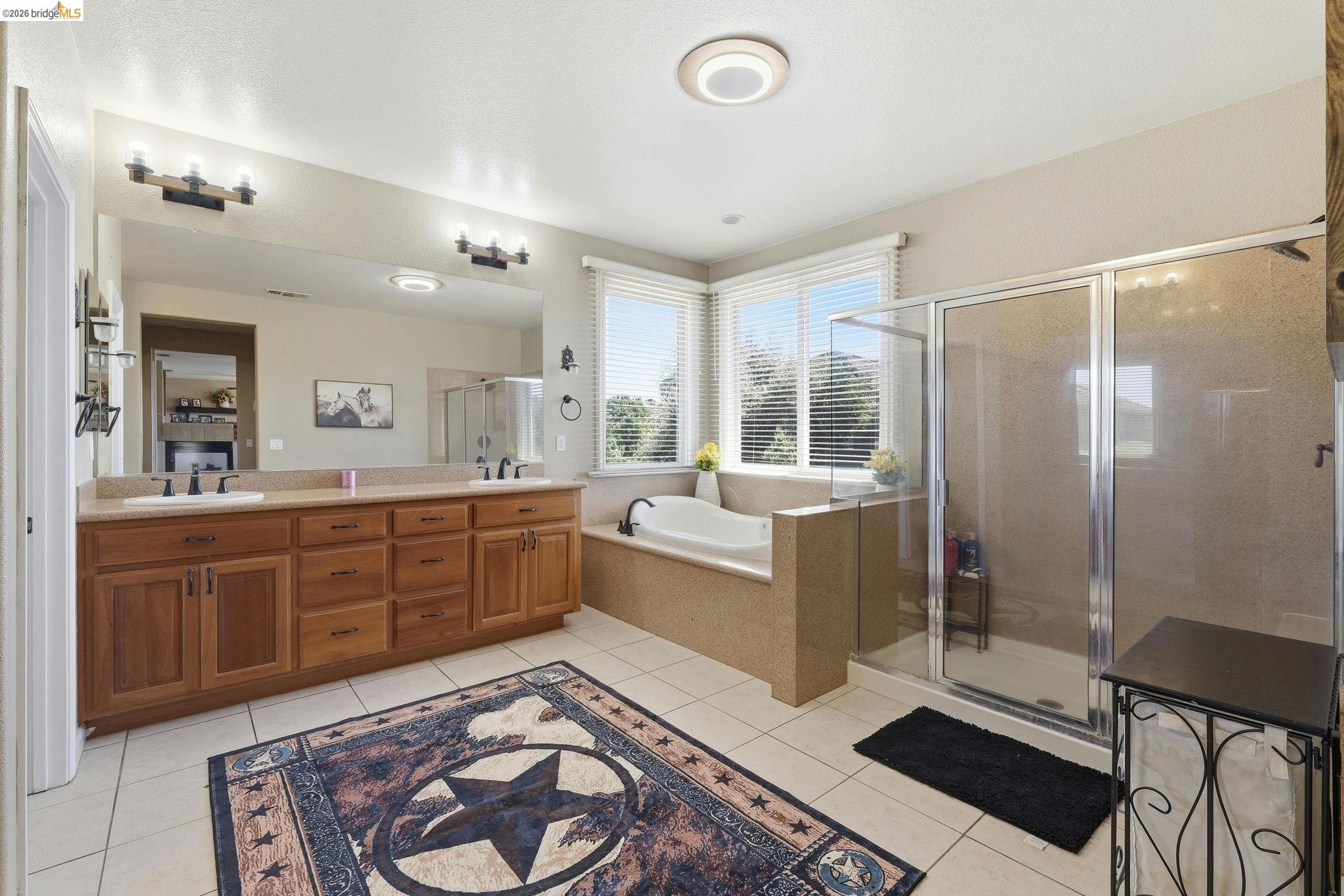 3438 Keystone Loop Discovery Bay, CA 94505 - Photo 26 of 57 a large bathroom with a glass door shower and sink