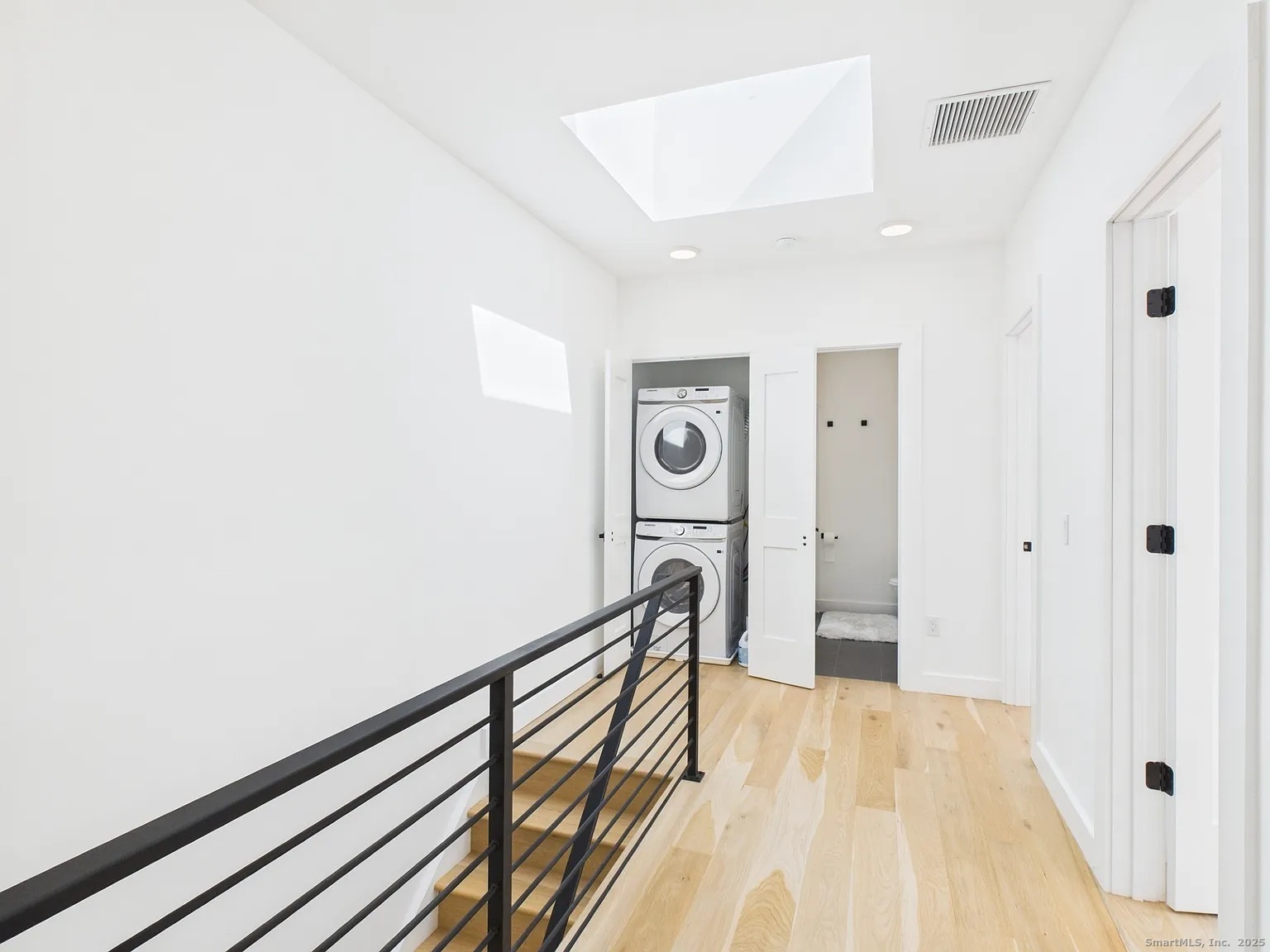 904 Quinnipiac Avenue, Unit 3 New Haven, CT 06513 - Photo 11 of 19 a view of a hallway with wooden floor