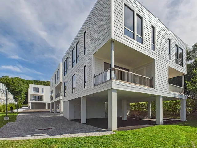 a view of a building with a yard