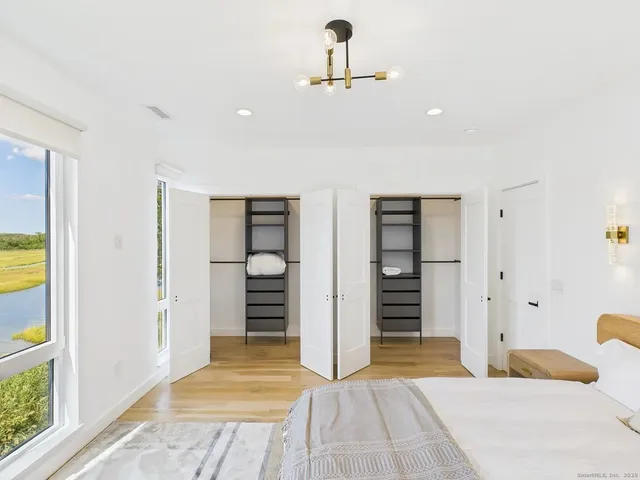 a bedroom with a bed and a walk in closet