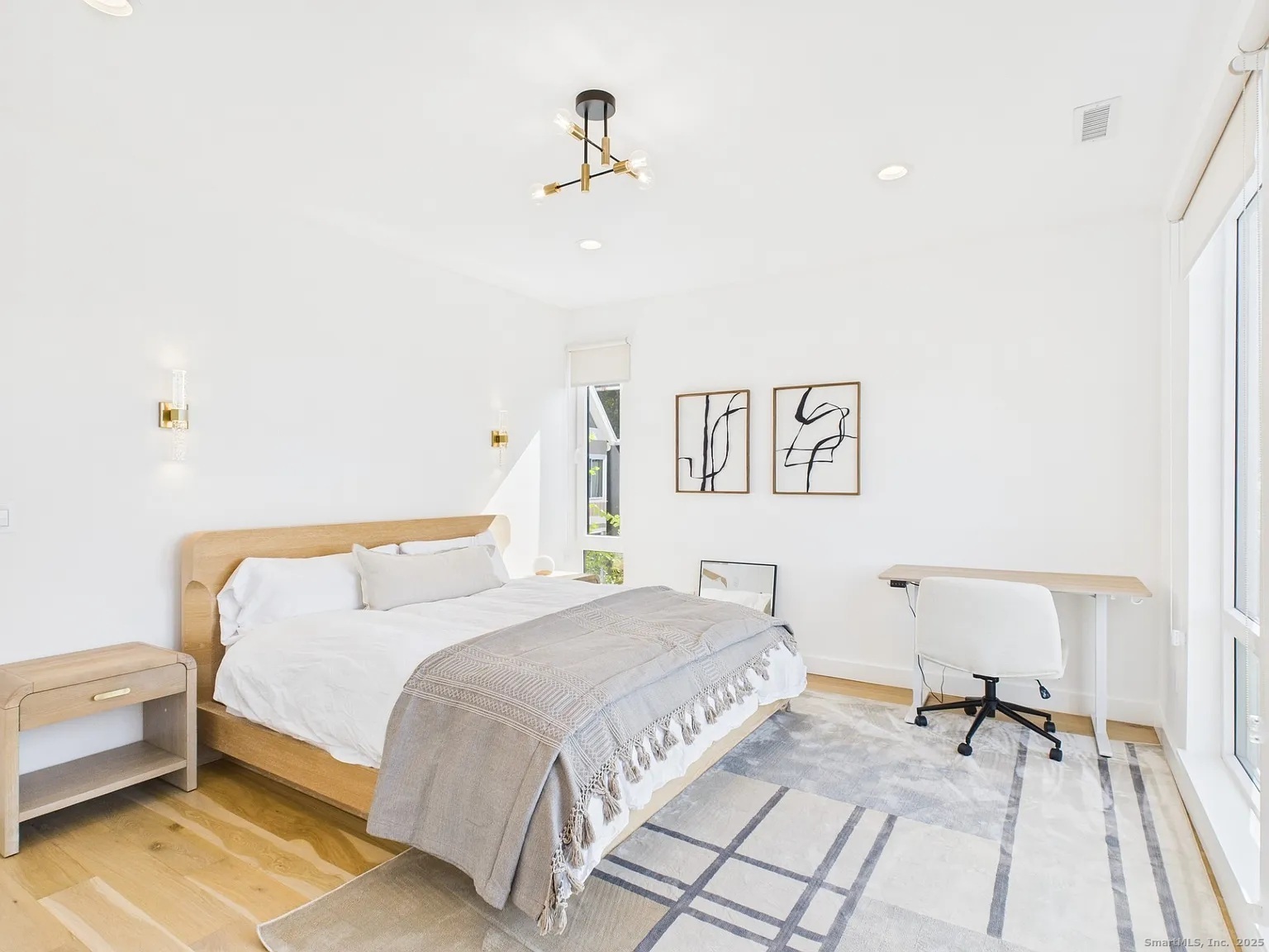 904 Quinnipiac Avenue, Unit 3 New Haven, CT 06513 - Photo 7 of 19 a bedroom with a bed and a table