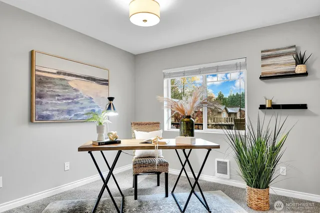 a dining room with furniture and window