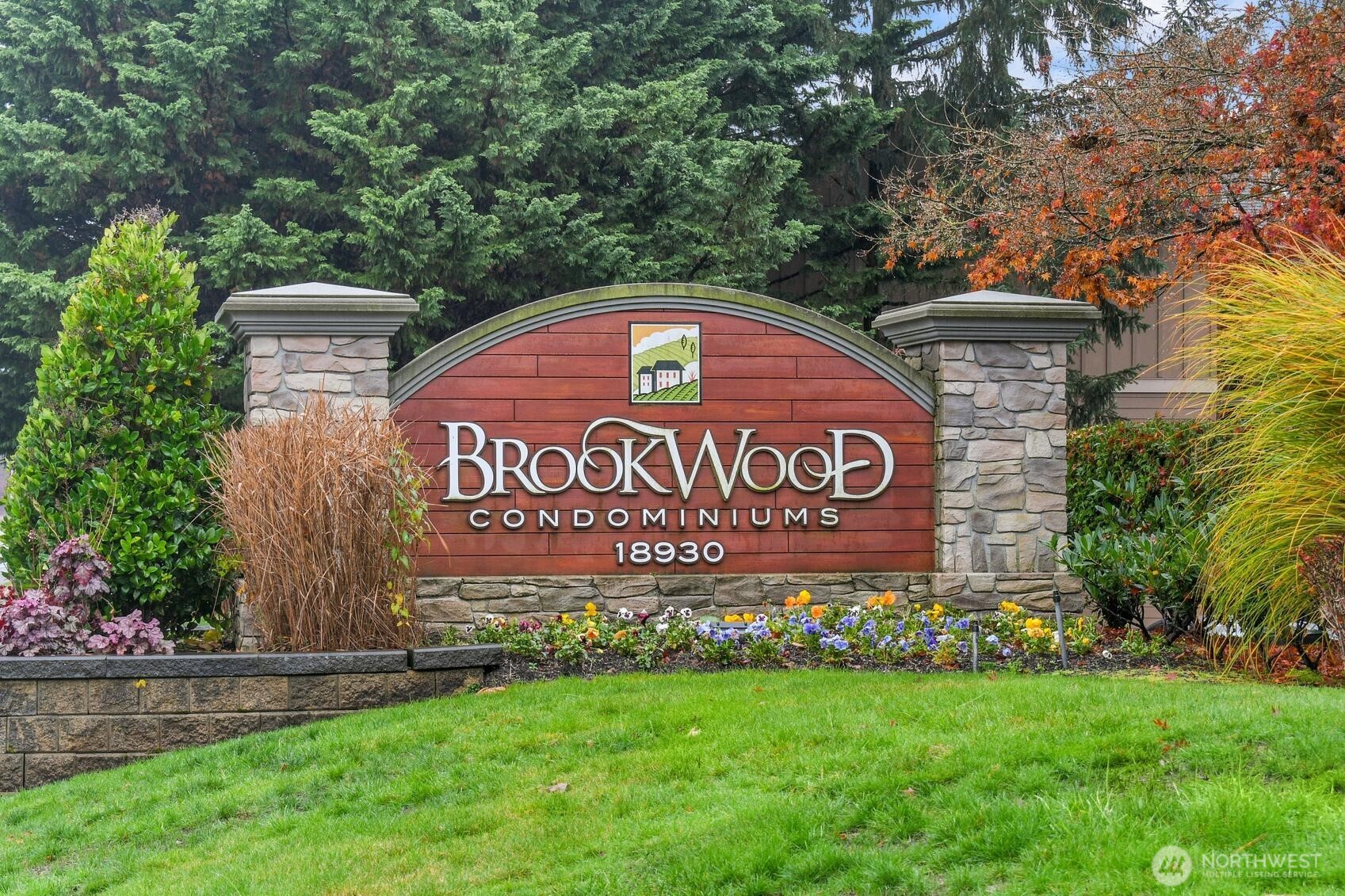 18930 Bothell Everett Highway, Unit F305 Bothell, WA 98012 - Photo 20 of 20 a sign on the side of a building