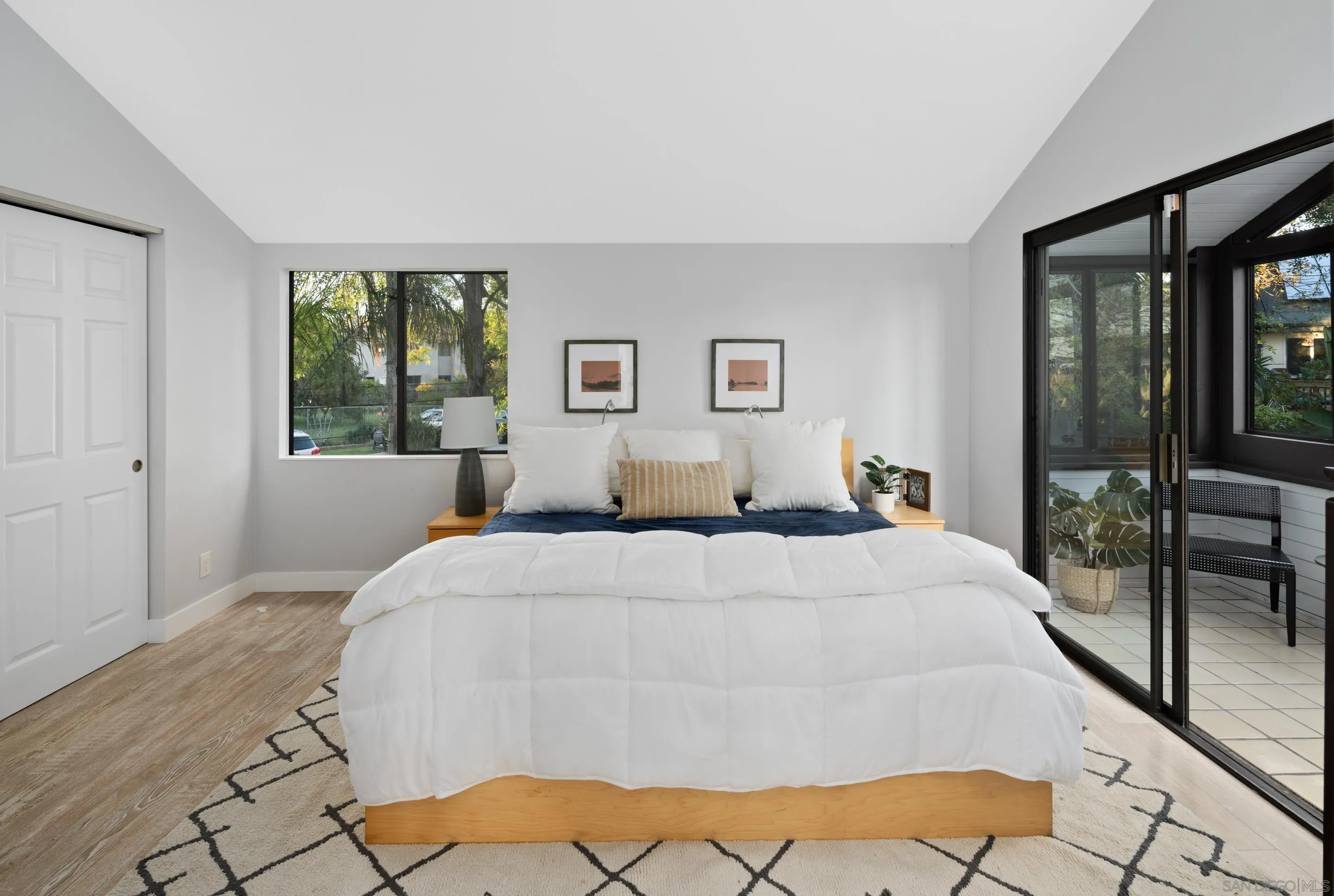 1557 Summit Avenue Cardiff, CA 92007 - Photo 11 of 28 a bedroom with a large bed and a large window