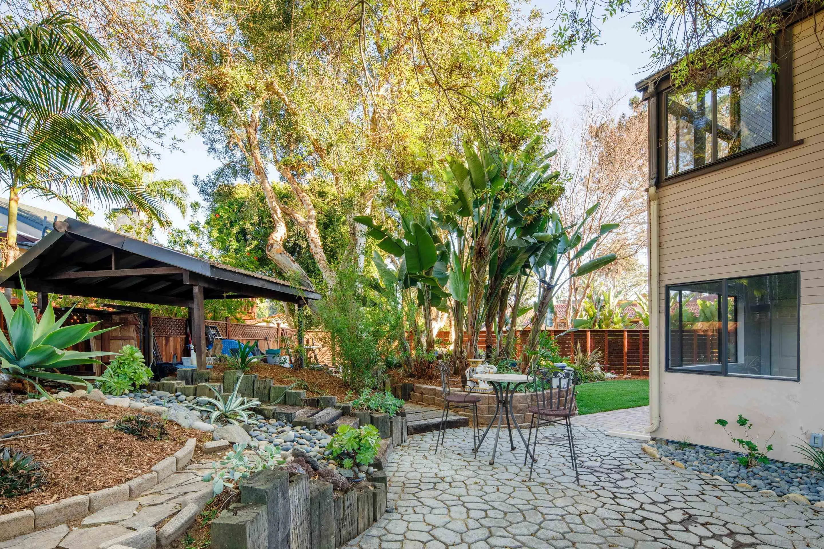 1557 Summit Avenue Cardiff, CA 92007 - Photo 17 of 28 a view of a chairs and table in backyard of the house
