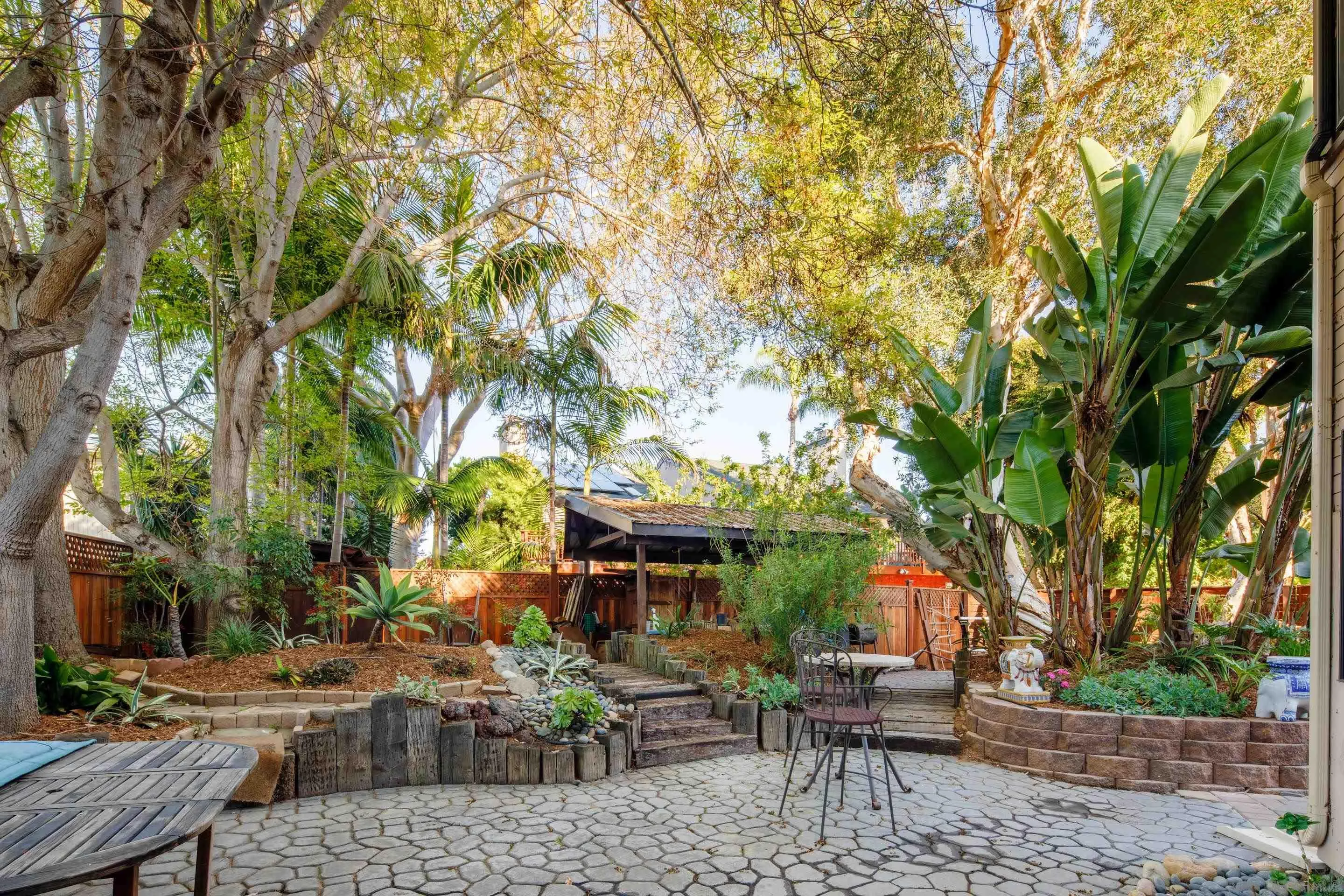 1557 Summit Avenue Cardiff, CA 92007 - Photo 18 of 28 a view of a patio with table and chairs and potted plants