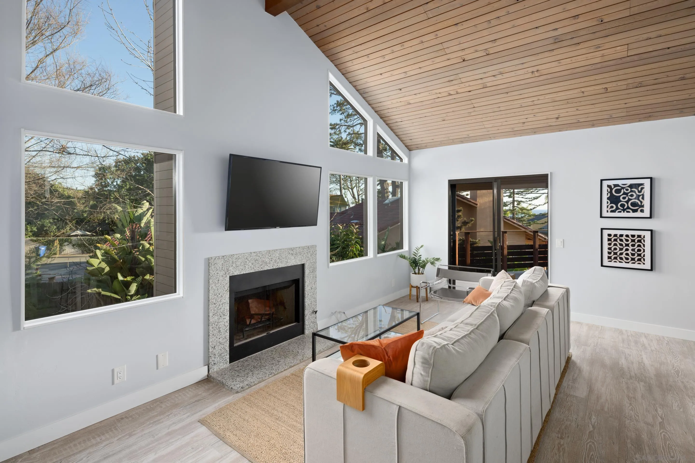 1557 Summit Avenue Cardiff, CA 92007 - Photo 8 of 28 a living room with furniture a fireplace and a flat screen tv