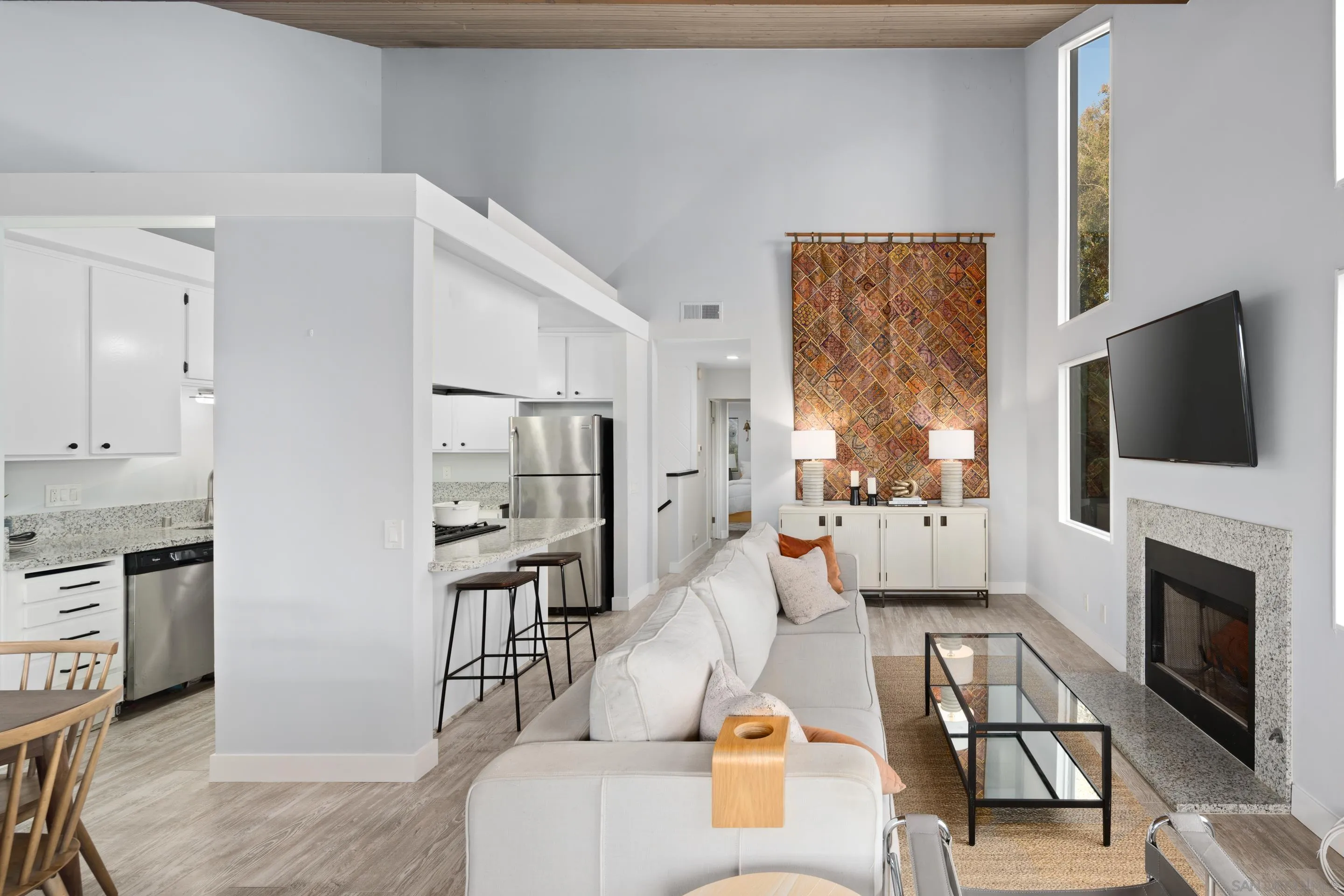 1557 Summit Avenue Cardiff, CA 92007 - Photo 9 of 28 a living room with furniture a flat screen tv and a fireplace