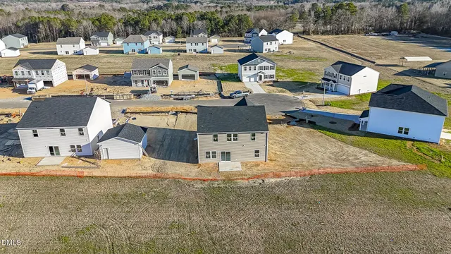 an aerial view of a house with outdoor space