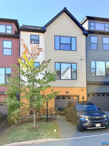 a view of a car parked in front of a building