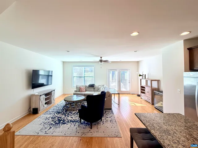a living room with fireplace furniture and a flat screen tv