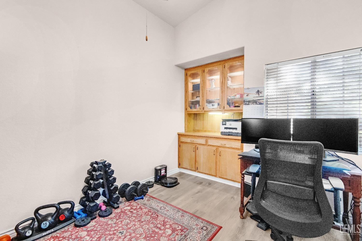 Undisclosed Address Bakersfield, CA 93312 - Photo 17 of 43 a room with furniture a rug and a window