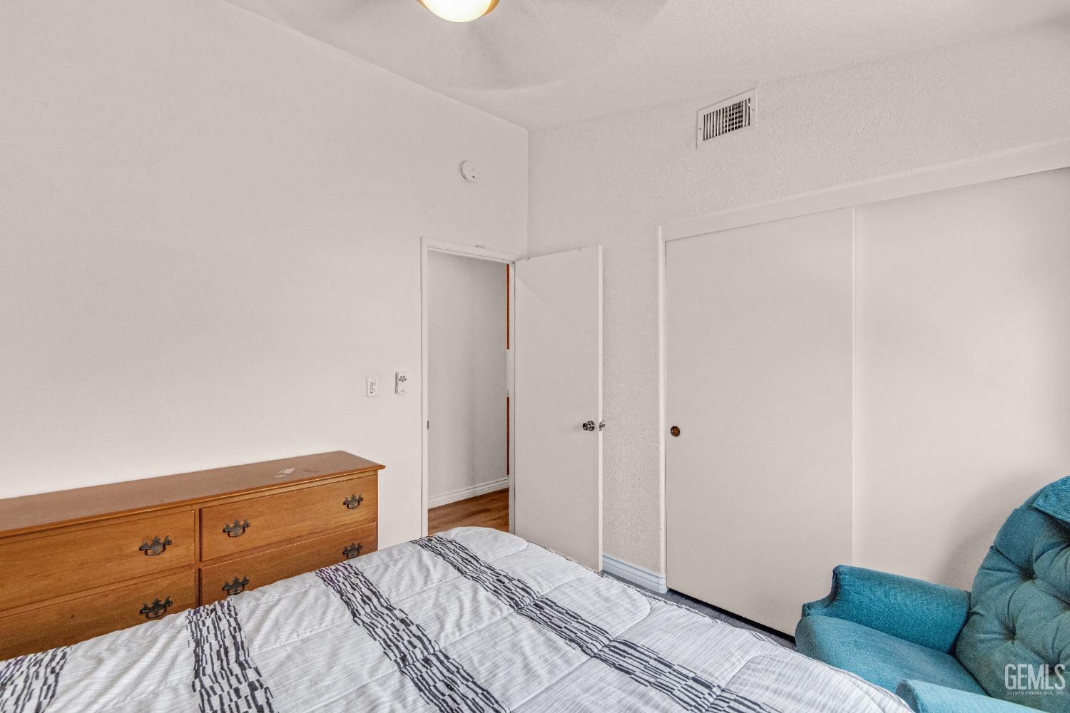 Undisclosed Address Bakersfield, CA 93312 - Photo 26 of 43 a bedroom with a bed and a couch