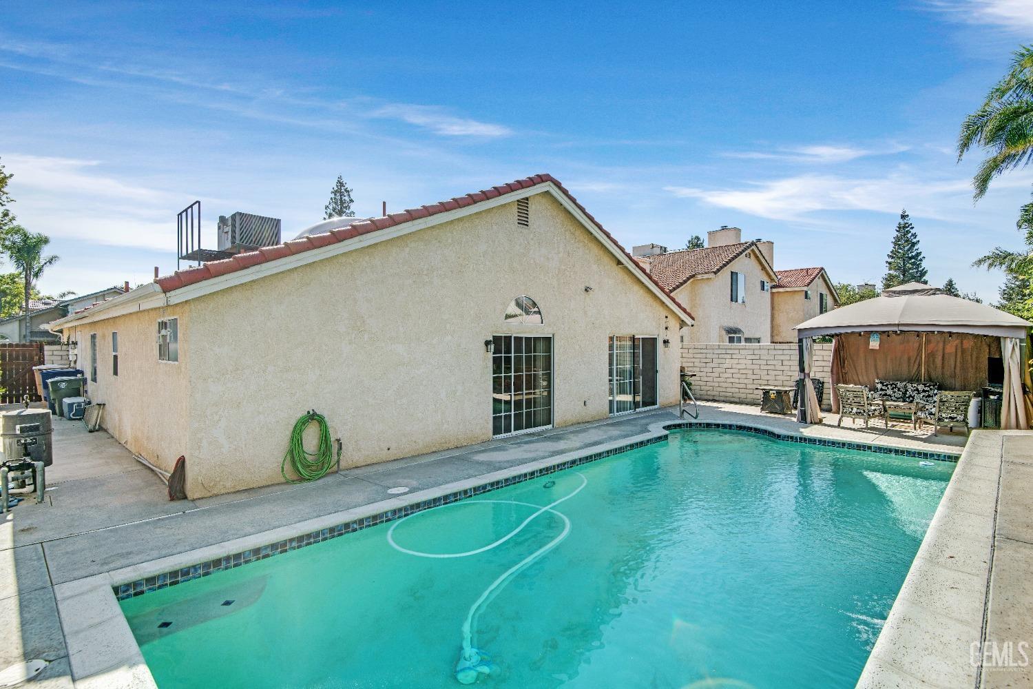 Undisclosed Address Bakersfield, CA 93312 - Photo 35 of 43 a view of a house with pool table and chairs