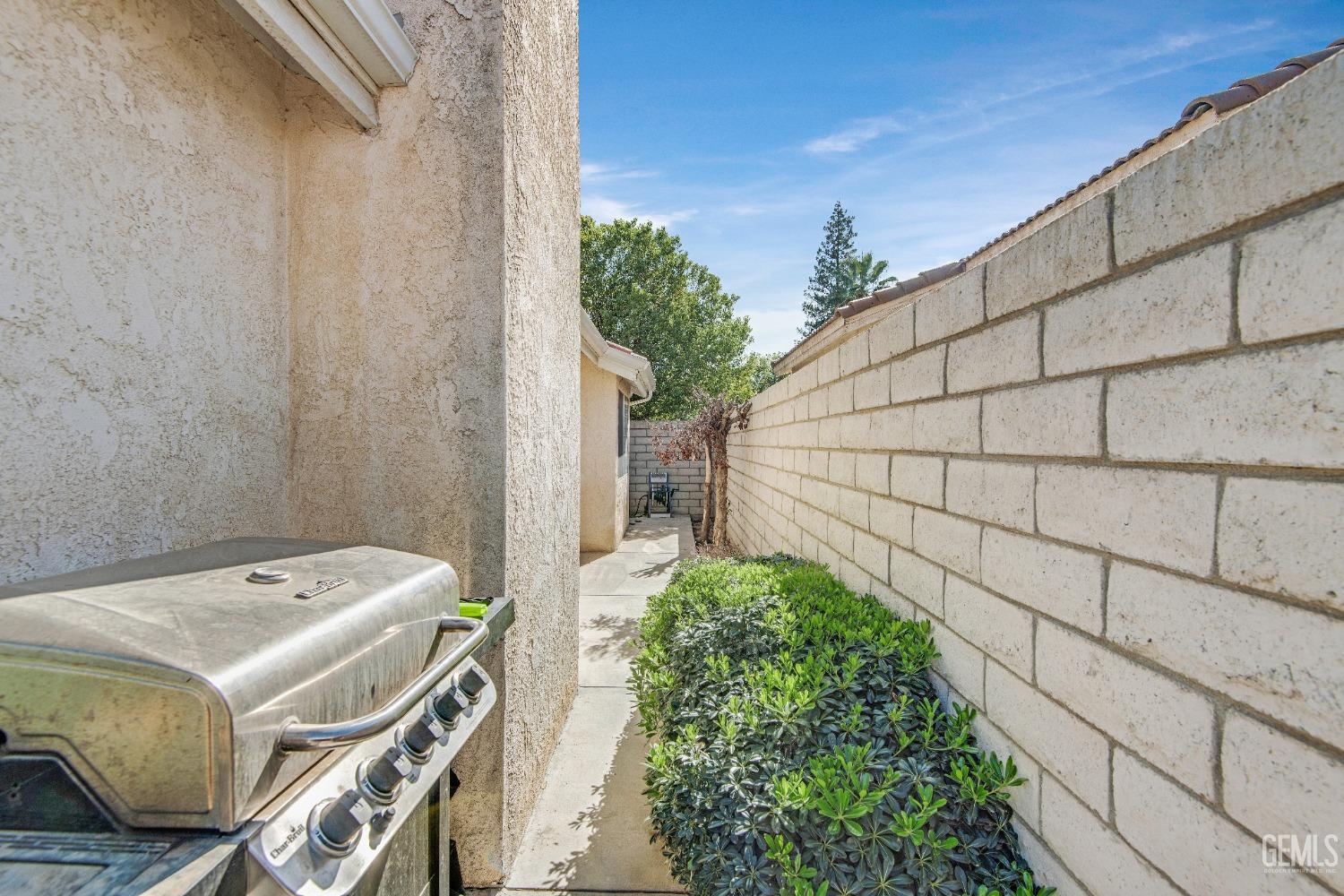 Undisclosed Address Bakersfield, CA 93312 - Photo 36 of 43 a backyard of a house with lots of green space