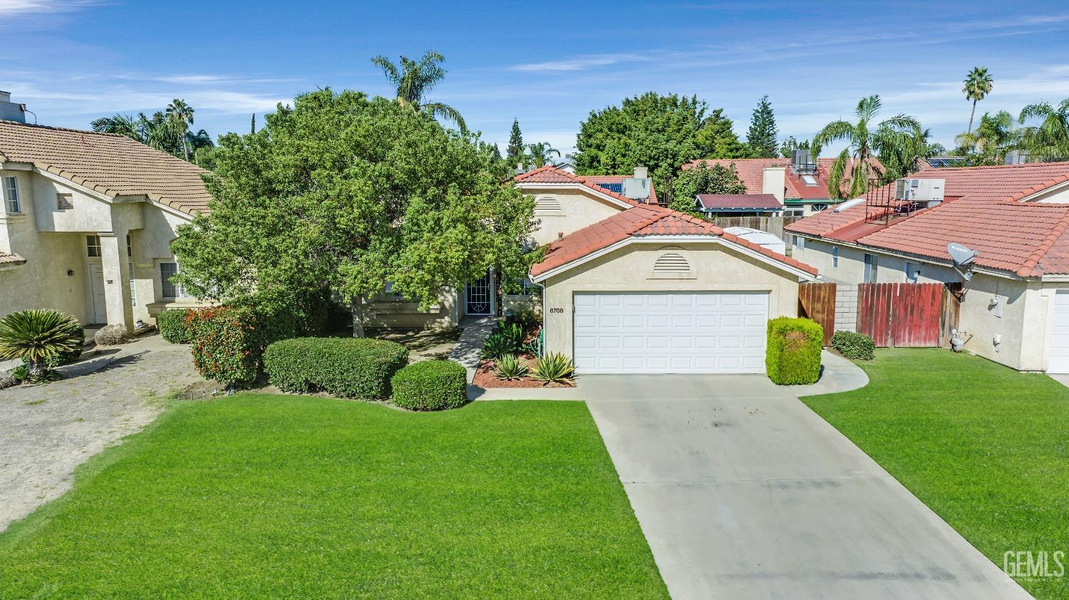 Undisclosed Address Bakersfield, CA 93312 - Photo 40 of 43 a front view of a house with garden