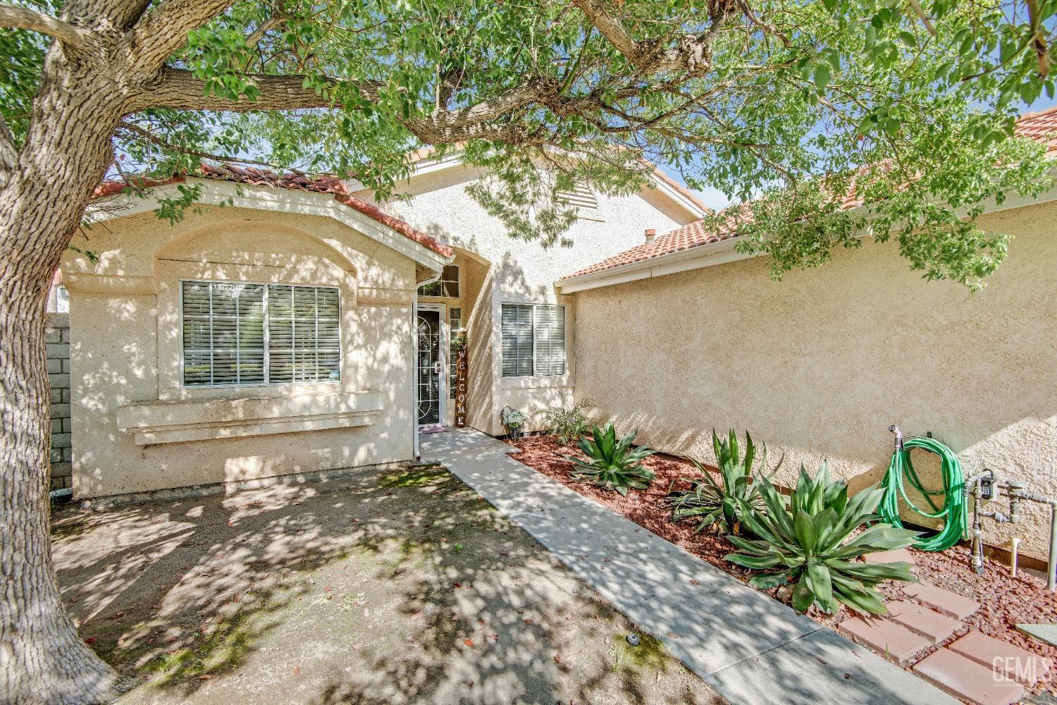 Undisclosed Address Bakersfield, CA 93312 - Photo 42 of 43 a front view of a house with a yard