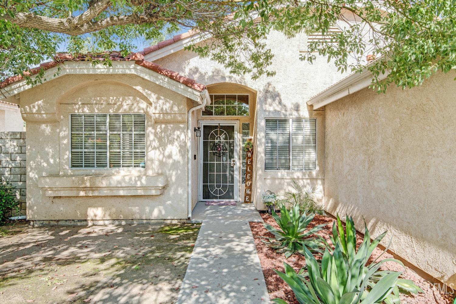 Undisclosed Address Bakersfield, CA 93312 - Photo 43 of 43 a front view of a house with a yard