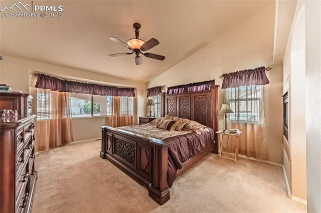 a bed sitting in a room next to a window