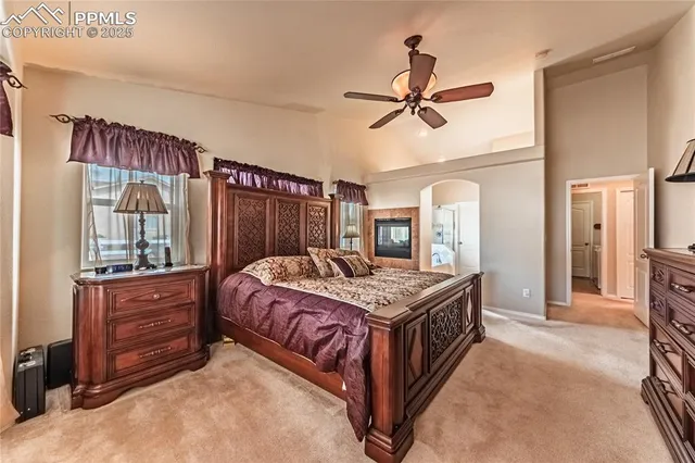 a bedroom with a bed and a mirror