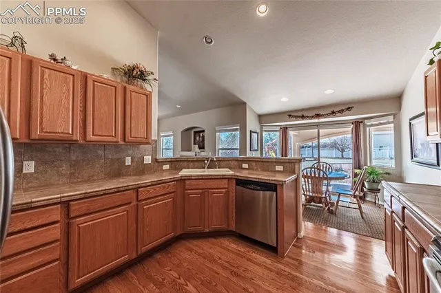 a kitchen with lots of counter top space and dining table