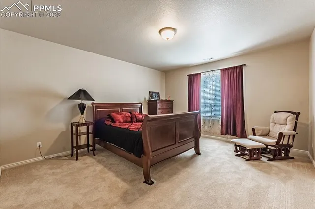 a bedroom with furniture and a window