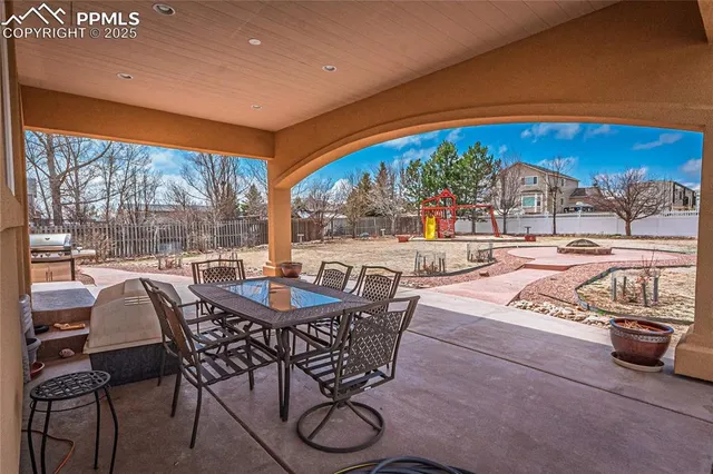 a view of a tables and chairs in patio