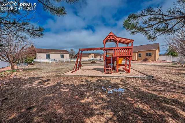 a view of swimming pool with sitting area and furniture