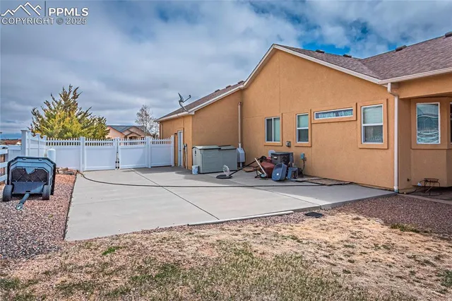 a view of a patio with a table and chairs