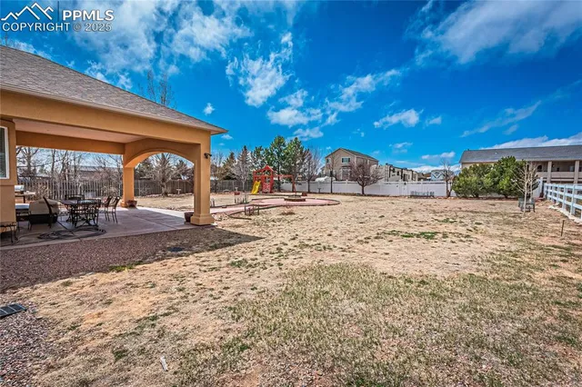 a view of yard with outdoor seating