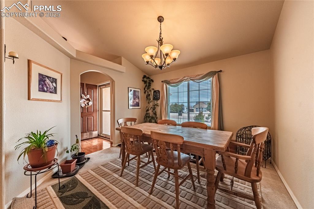 11171 Allendale Drive Peyton, CO 80831 - Photo 8 of 50 a view of a dining room with furniture window and wooden floor