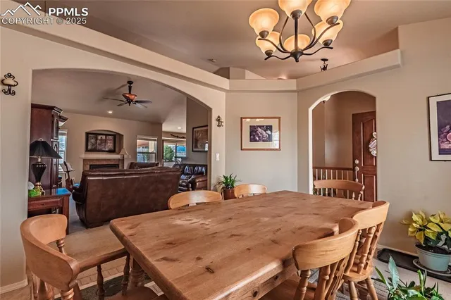 a dining room with wooden floor and breakfast area